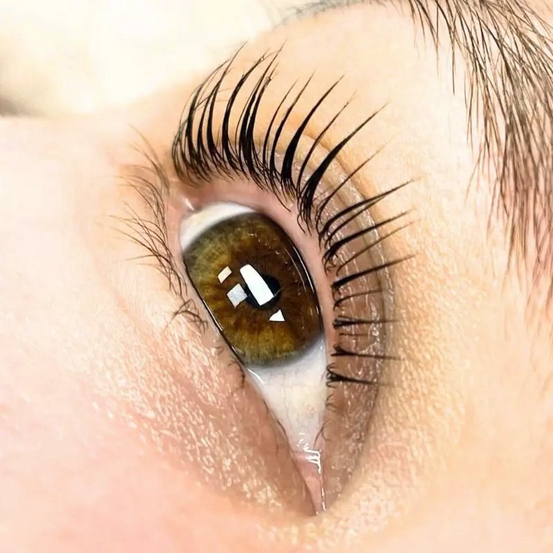 Natural lashes before and after a Korean lash lift with AURA Monaco formulas.